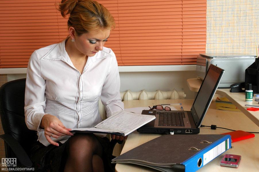 20P Upskirt office girl pushes down her classy black tights for some