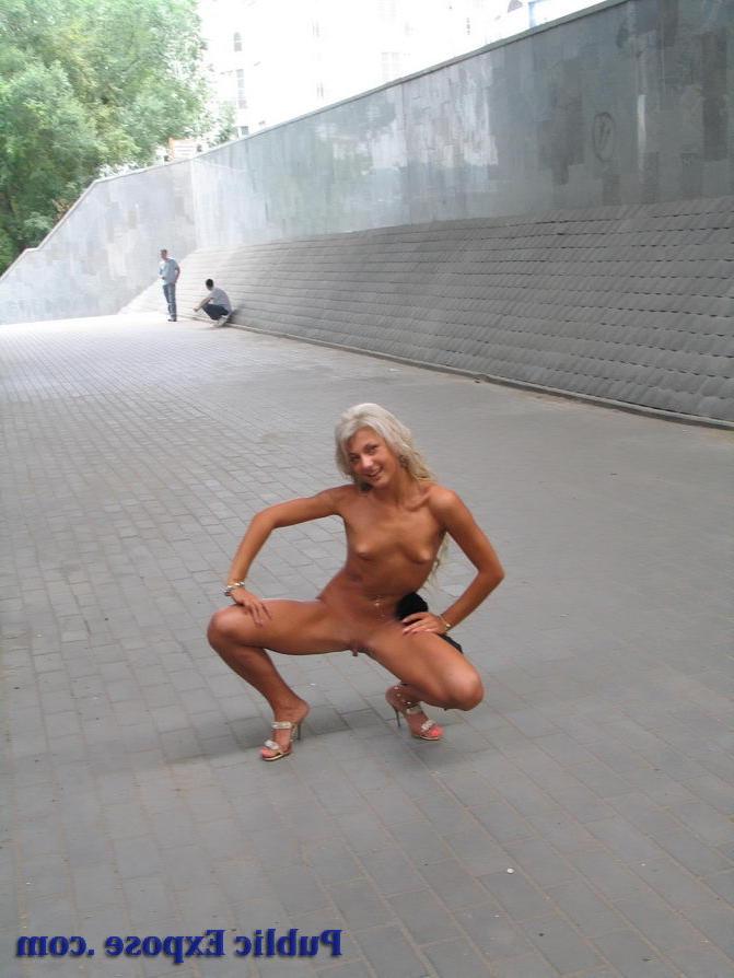 15P Tanned blonde girl takes off her dress in public