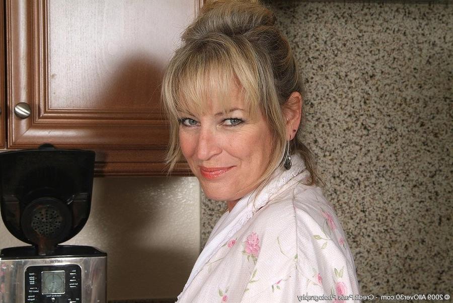 15P Bored Blonde Mature Does A Strip Tease In The Kitchen