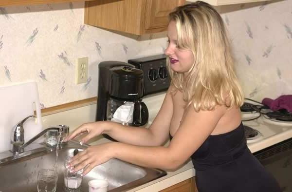 15P Big breasted amateur girl posing in the kitchen