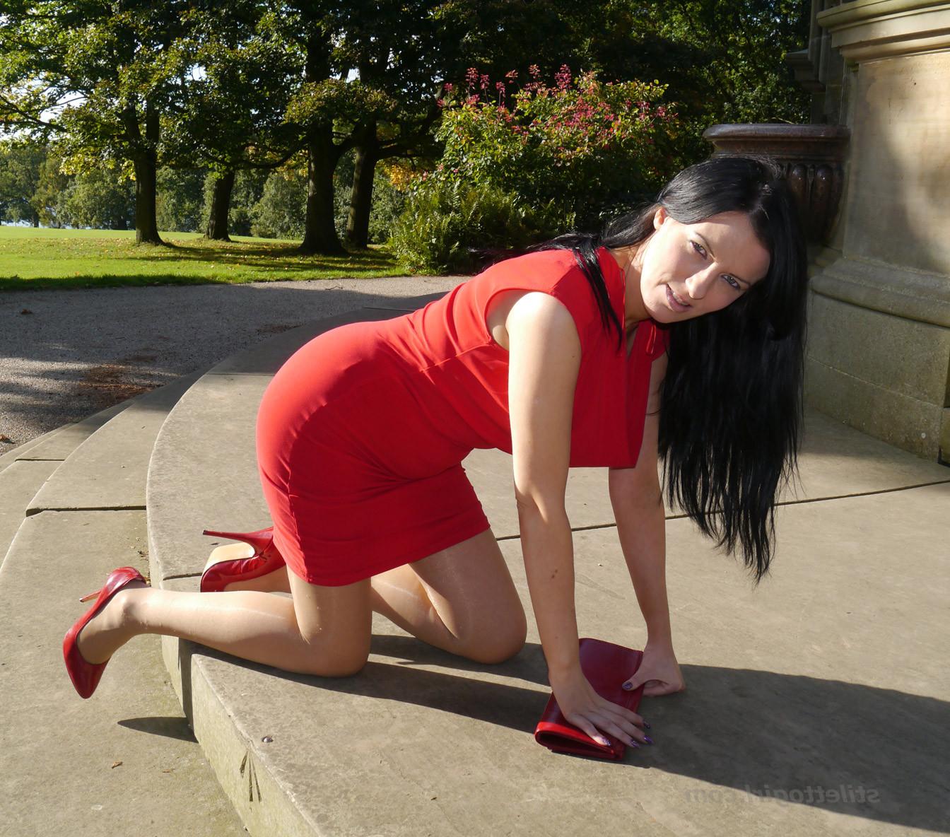 12P Sexy babe with shoe fetish takes a stroll outdoors wearing a tight red dress wit