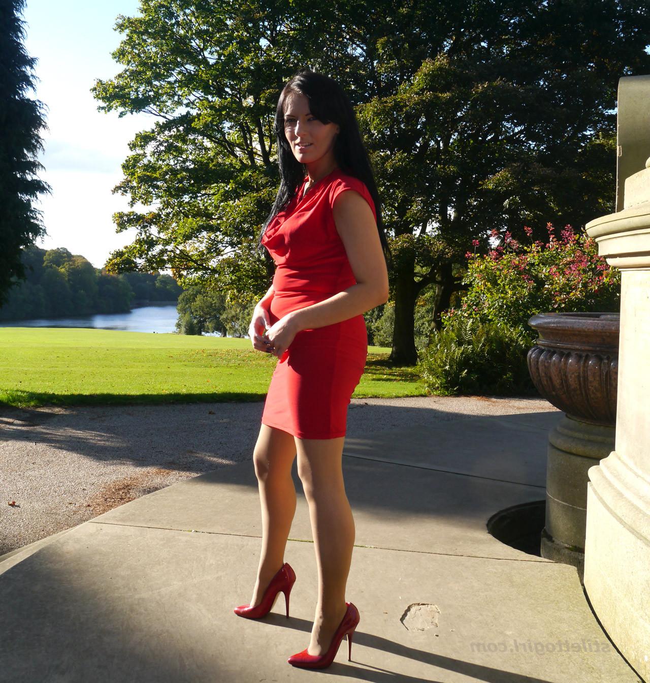 12P Sexy babe with shoe fetish takes a stroll outdoors wearing a tight red dress wit