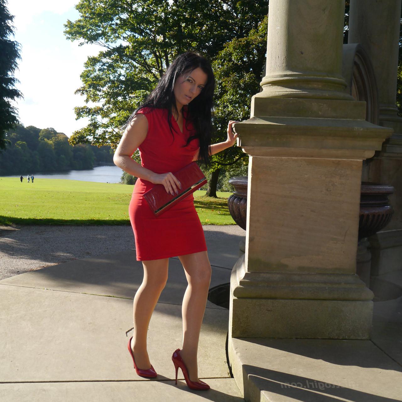 12P Sexy babe with shoe fetish takes a stroll outdoors wearing a tight red dress wit