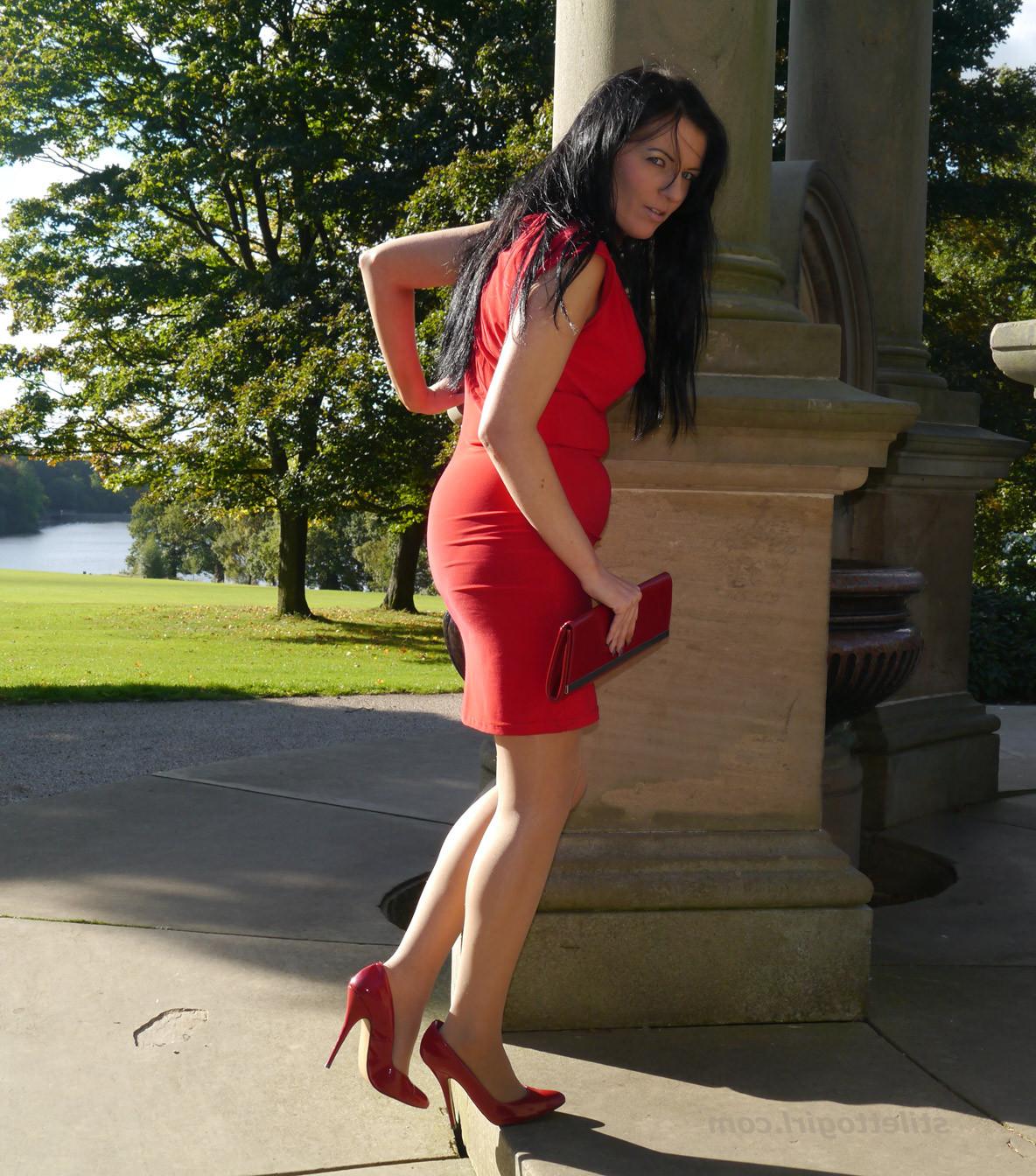 12P Sexy babe with shoe fetish takes a stroll outdoors wearing a tight red dress wit