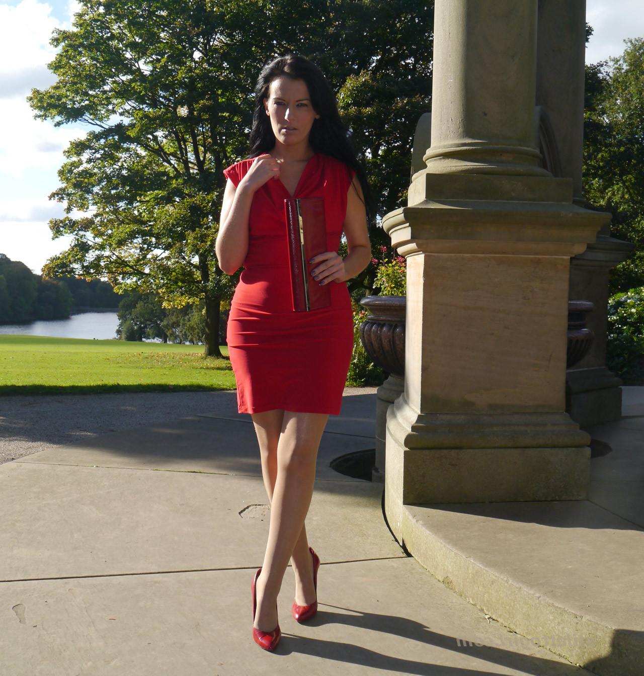 12P Sexy babe with shoe fetish takes a stroll outdoors wearing a tight red dress wit