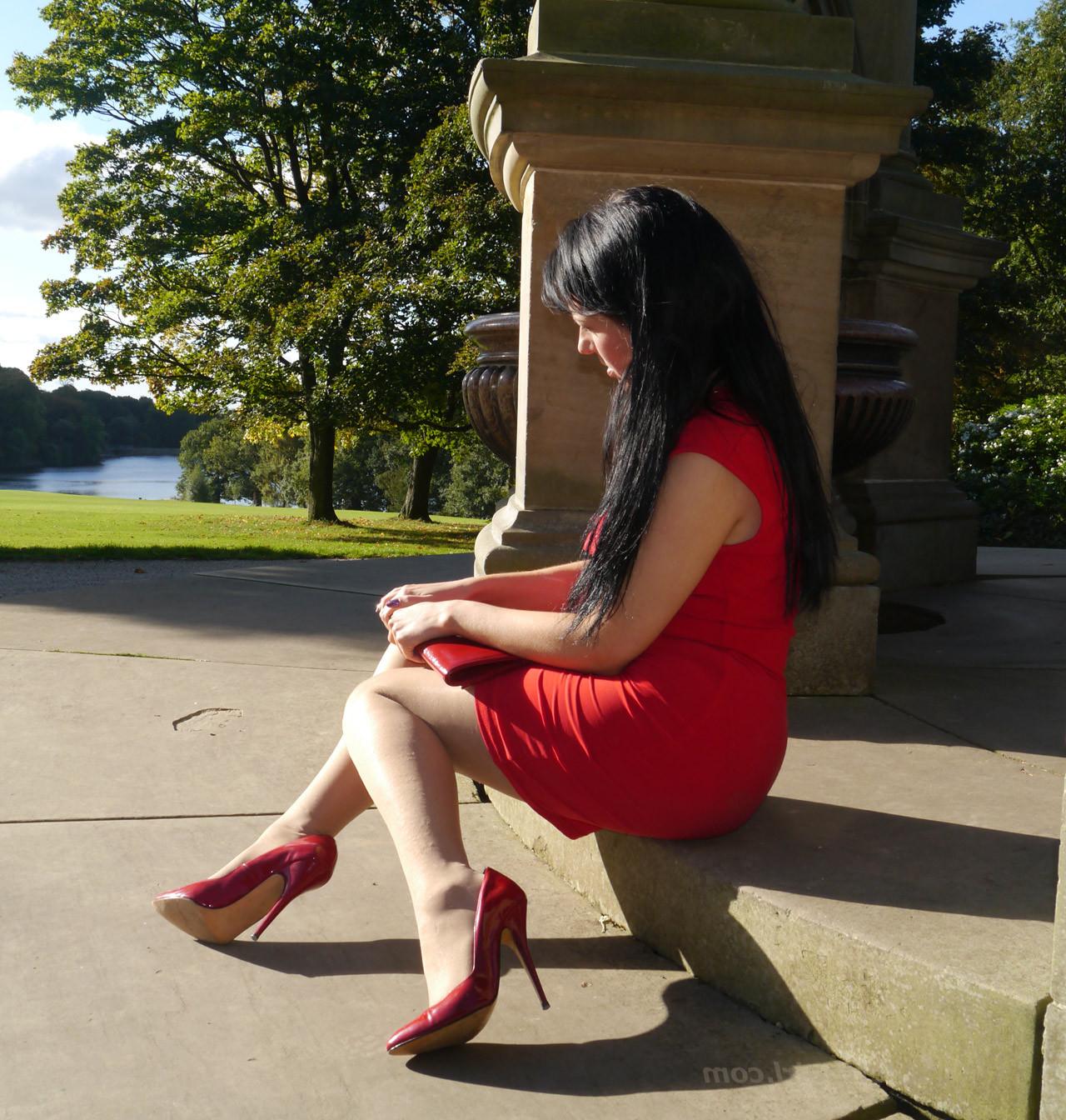 12P Sexy babe with shoe fetish takes a stroll outdoors wearing a tight red dress wit