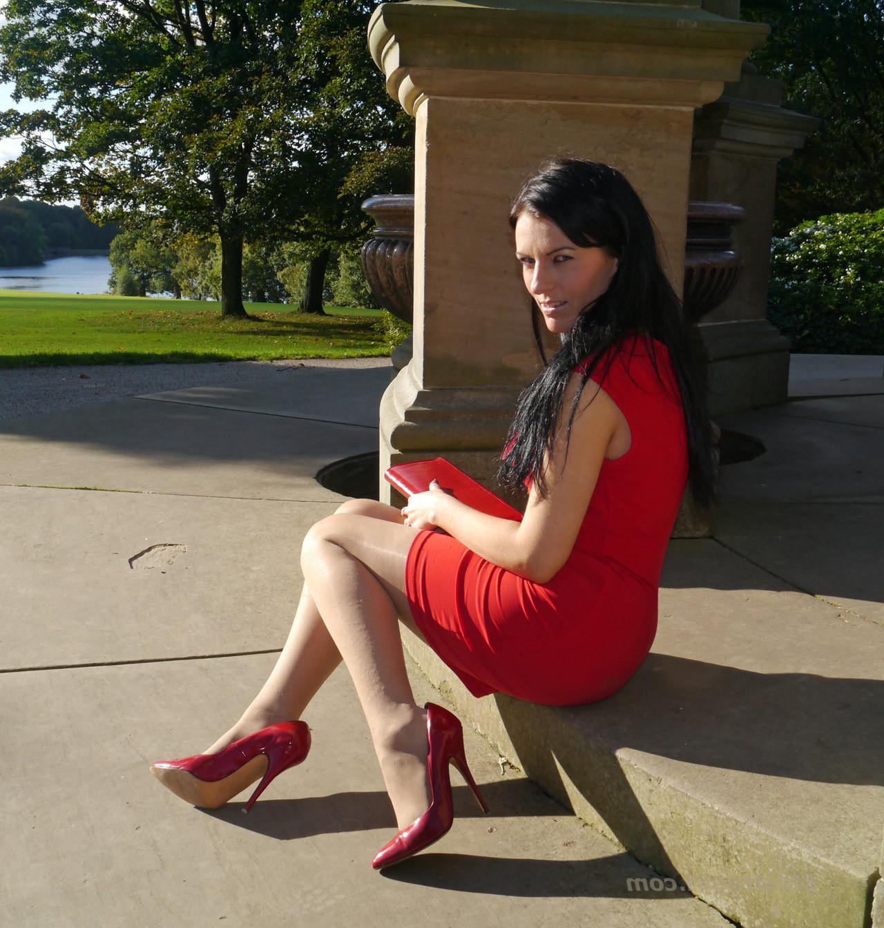 12P Sexy babe with shoe fetish takes a stroll outdoors wearing a tight red dress wit