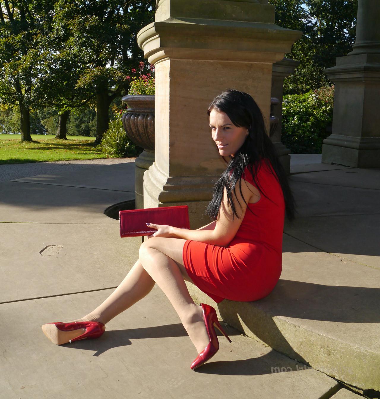 12P Sexy babe with shoe fetish takes a stroll outdoors wearing a tight red dress wit