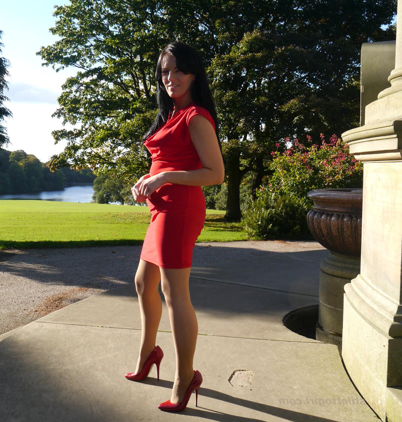 12P Sexy babe with shoe fetish takes a stroll outdoors wearing a tight red dress wit