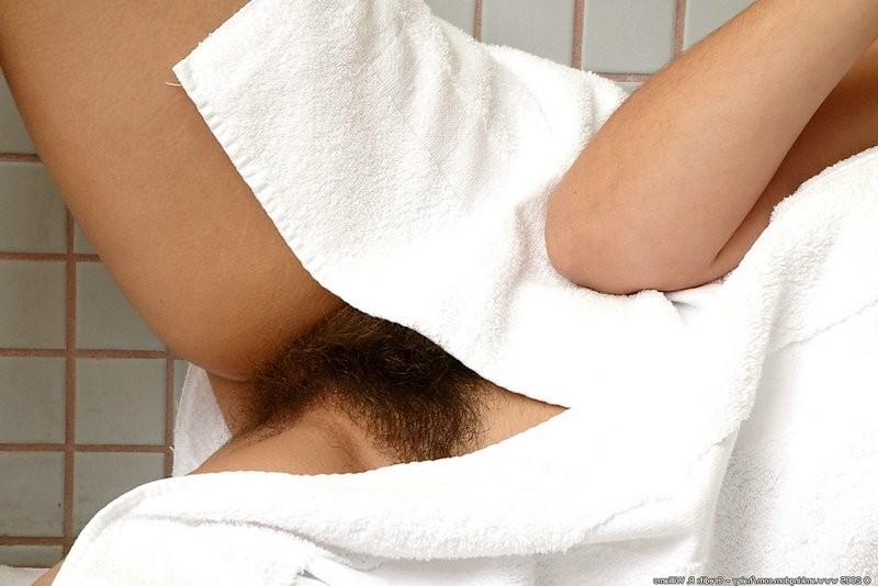 15P Naturally hairy brunette poses sexy in the shower