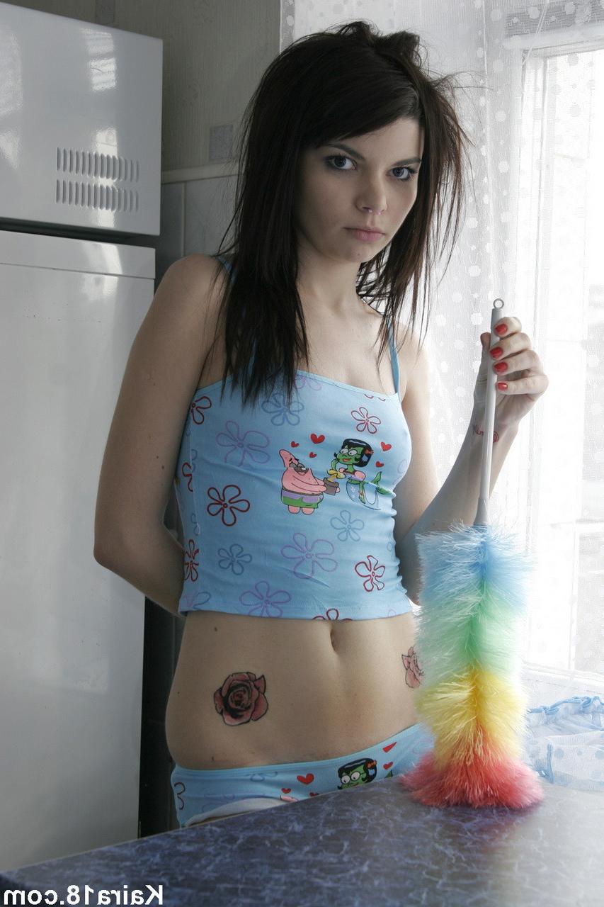 15P Skinny brunette emo chick undressing in the kitchen