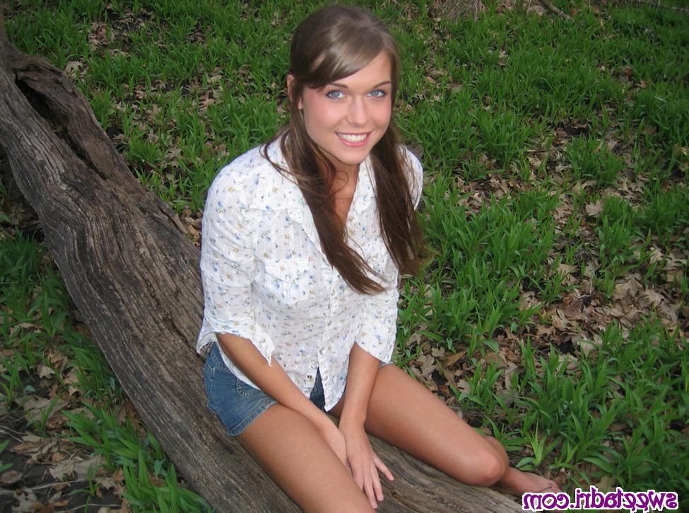 16P SweetAdri posing in nature with a white top on