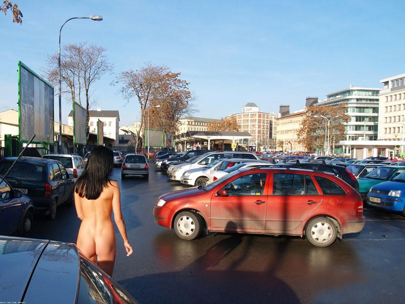 15P A sexy brunette model babe flashing nude in public
