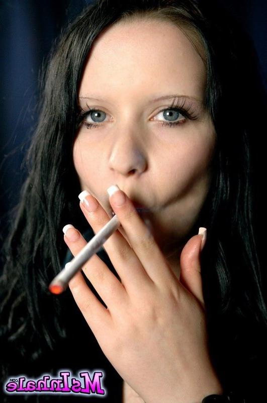 16P brunette teen smoking a cigarette