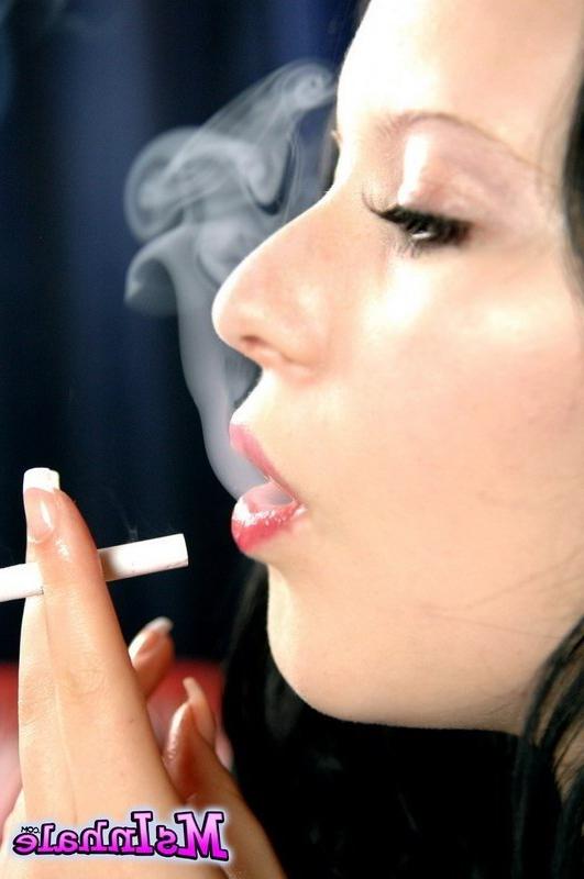 16P brunette teen smoking a cigarette