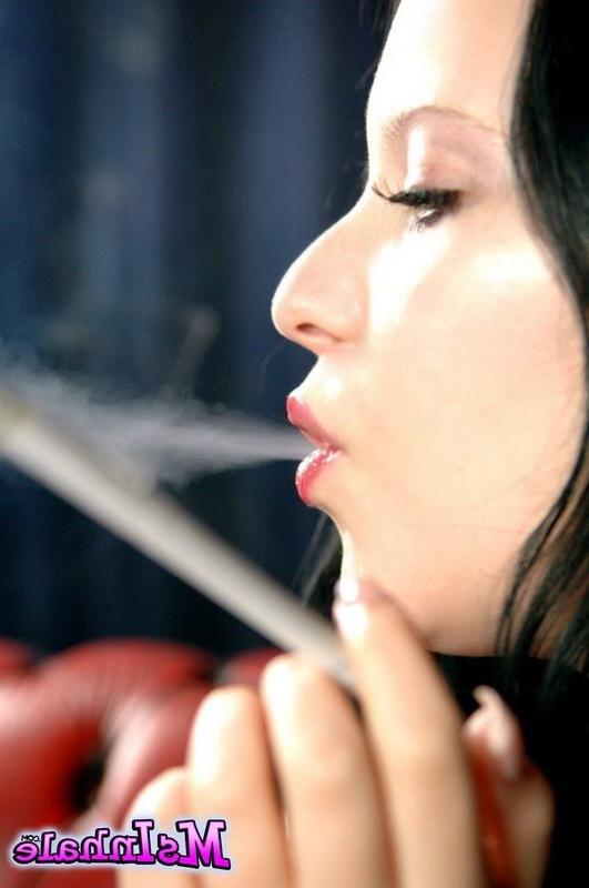 16P brunette teen smoking a cigarette