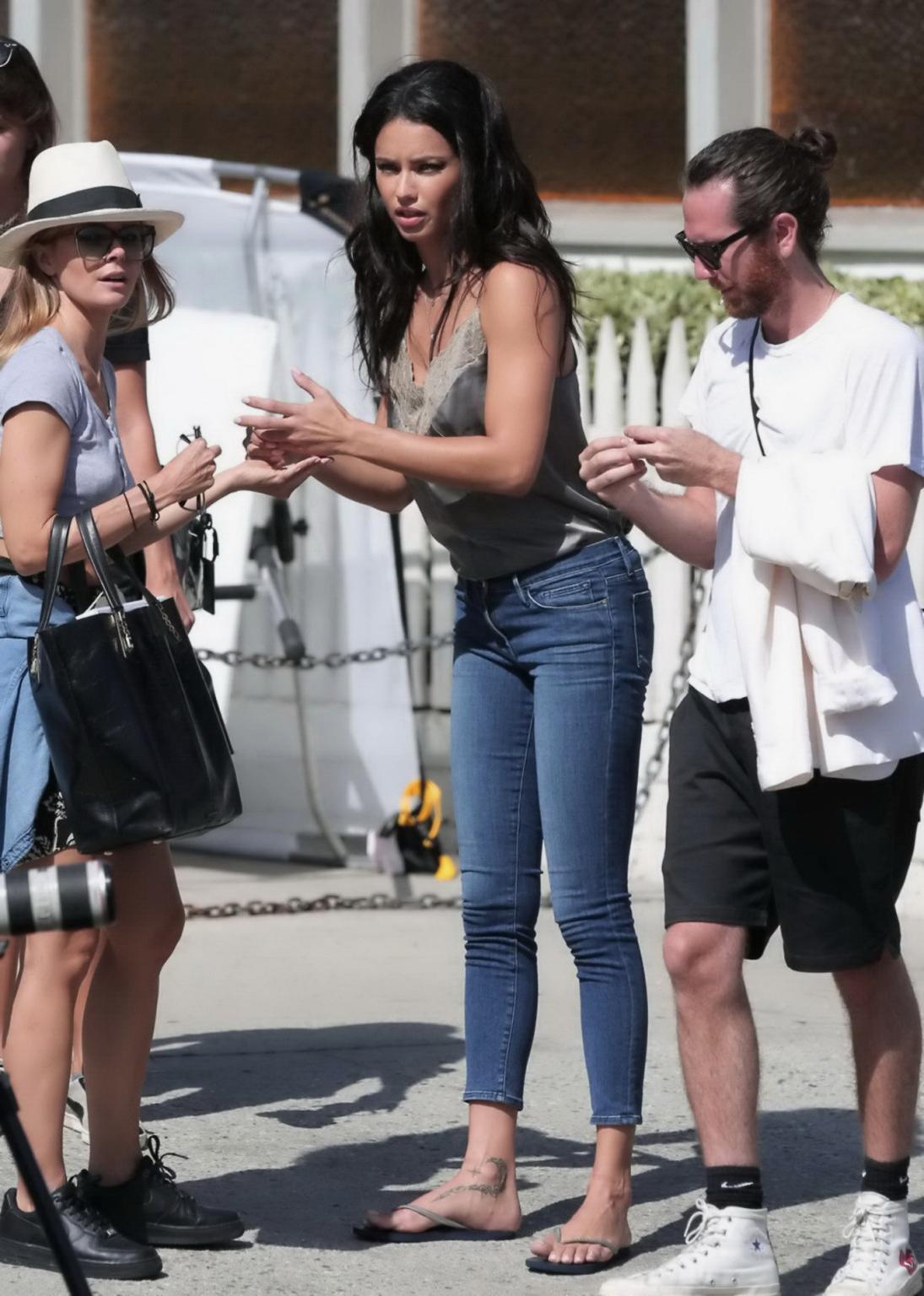16P Adriana Lima showing big cleavage and nipple pokies