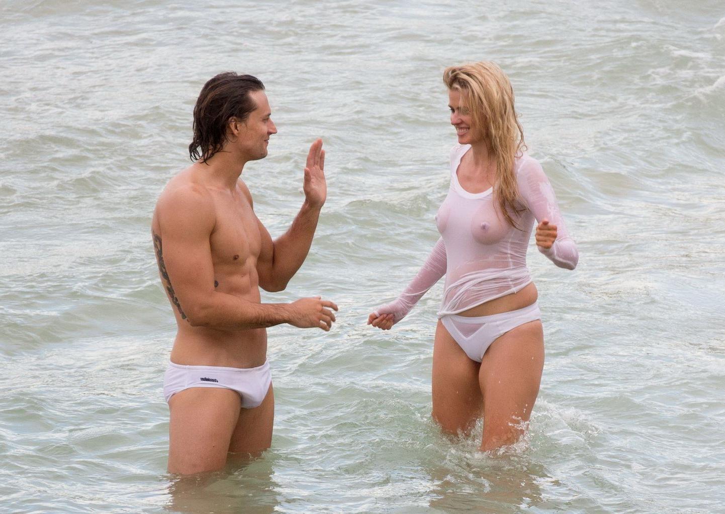 16P Lara Stone showing boobs in wet top and bikini bottom