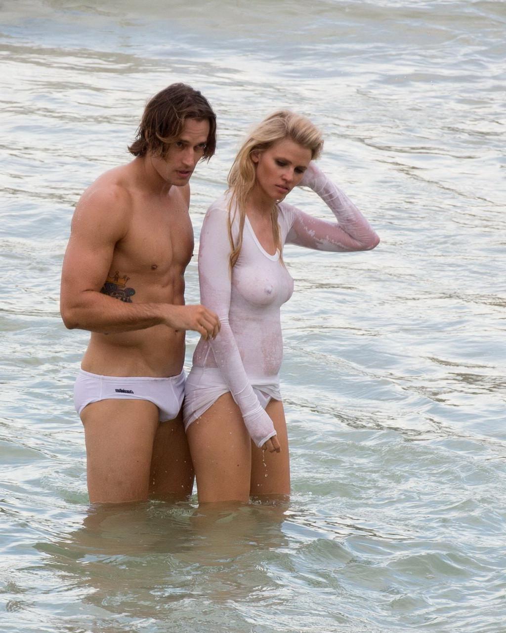 16P Lara Stone showing boobs in wet top and bikini bottom