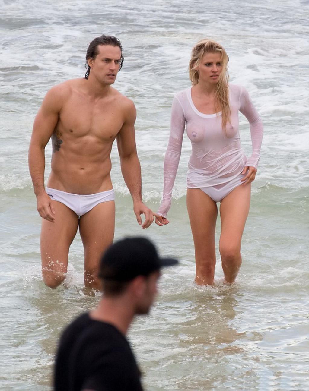 16P Lara Stone showing boobs in wet top and bikini bottom