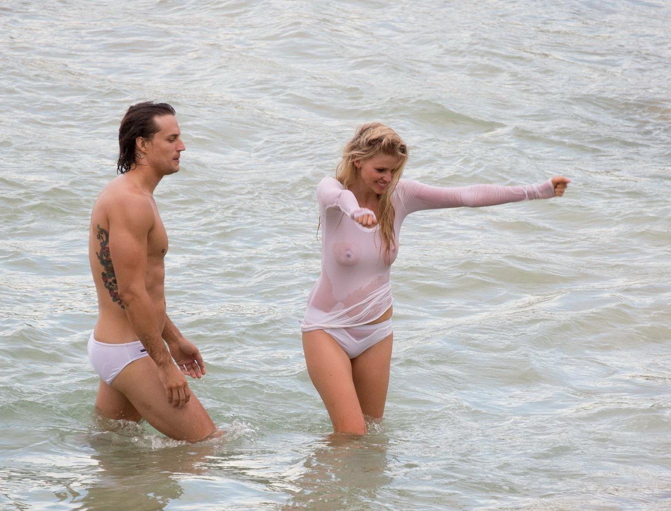 16P Lara Stone showing boobs in wet top and bikini bottom