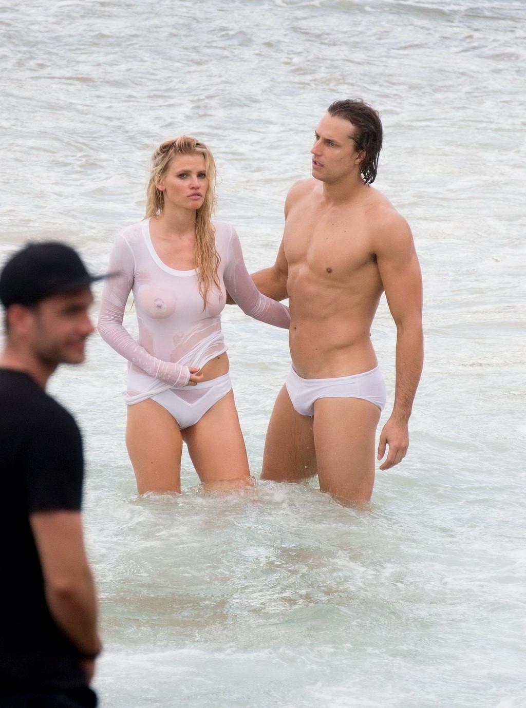 16P Lara Stone showing boobs in wet top and bikini bottom