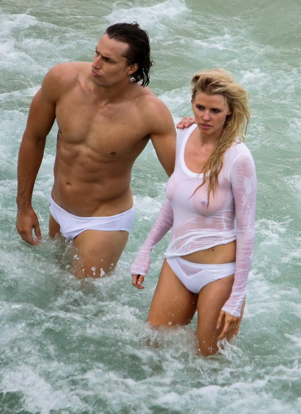 16P Lara Stone showing boobs in wet top and bikini bottom