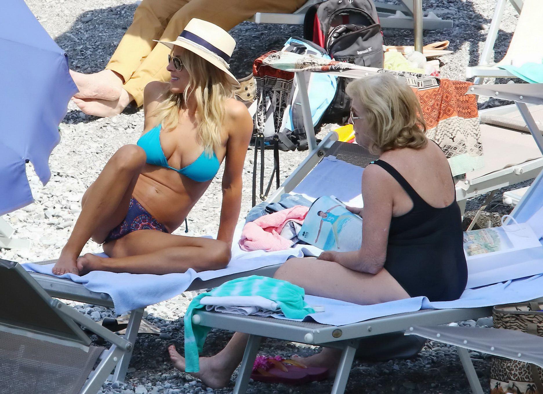 16P Brittany Daniel hot nipple slip in a tiny blue bikini