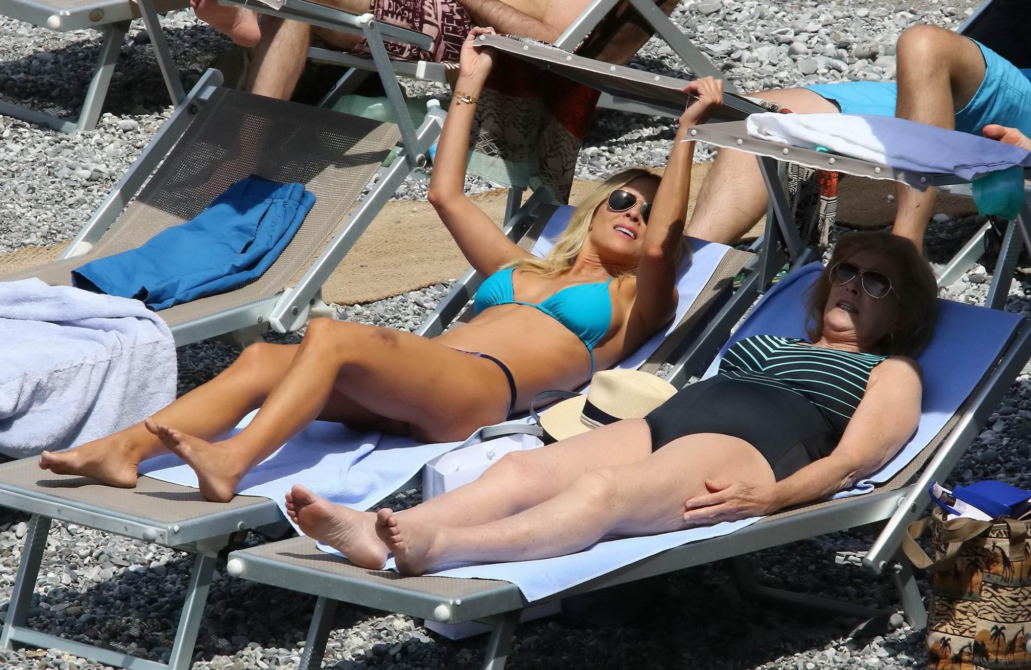 16P Brittany Daniel hot nipple slip in a tiny blue bikini