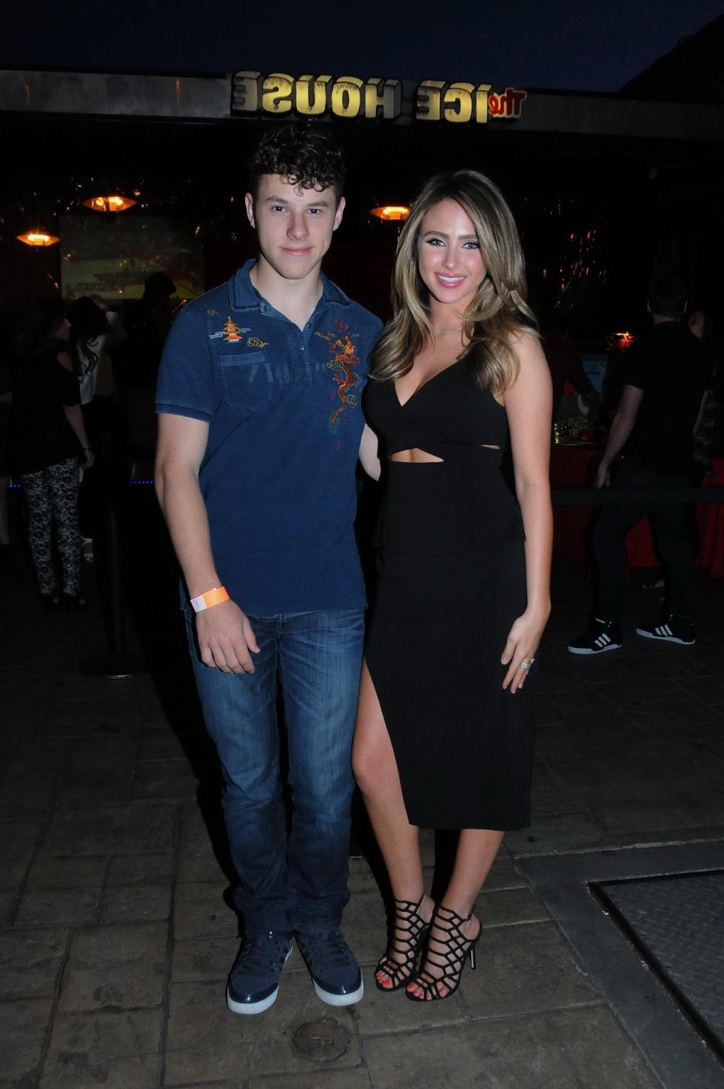 16P Ryan Newman showing big cleavage in black mini dress