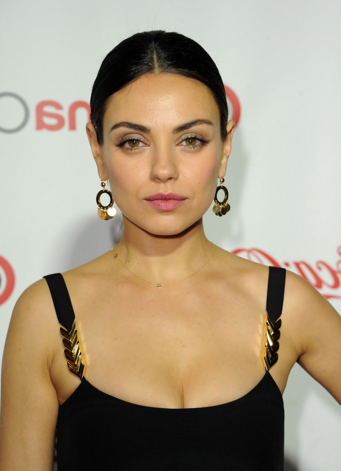 16P Mila Kunis showing big cleavage in hot monochrome dress