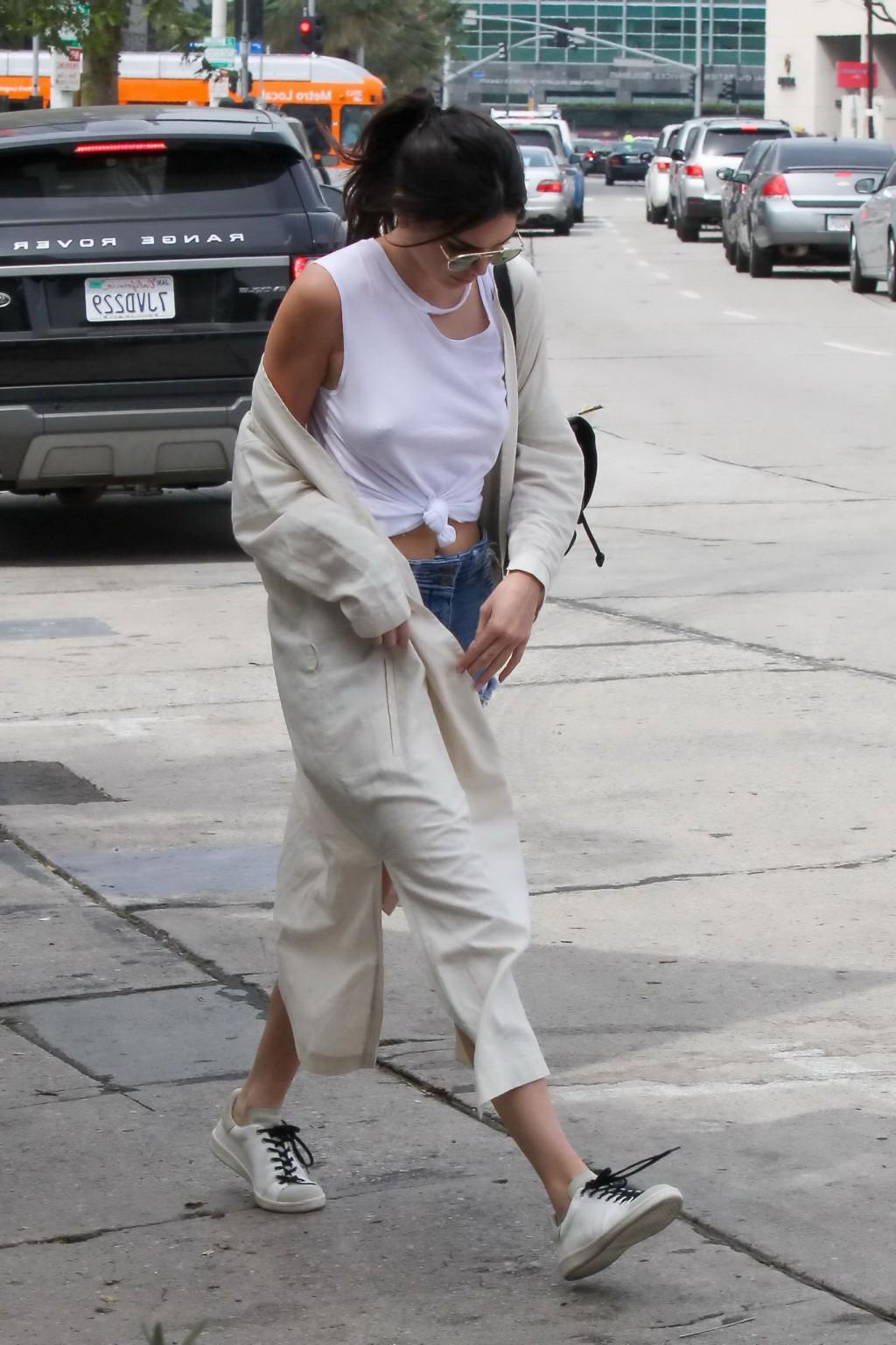 16P Kendall Jenner showing pokies and nipple piercing