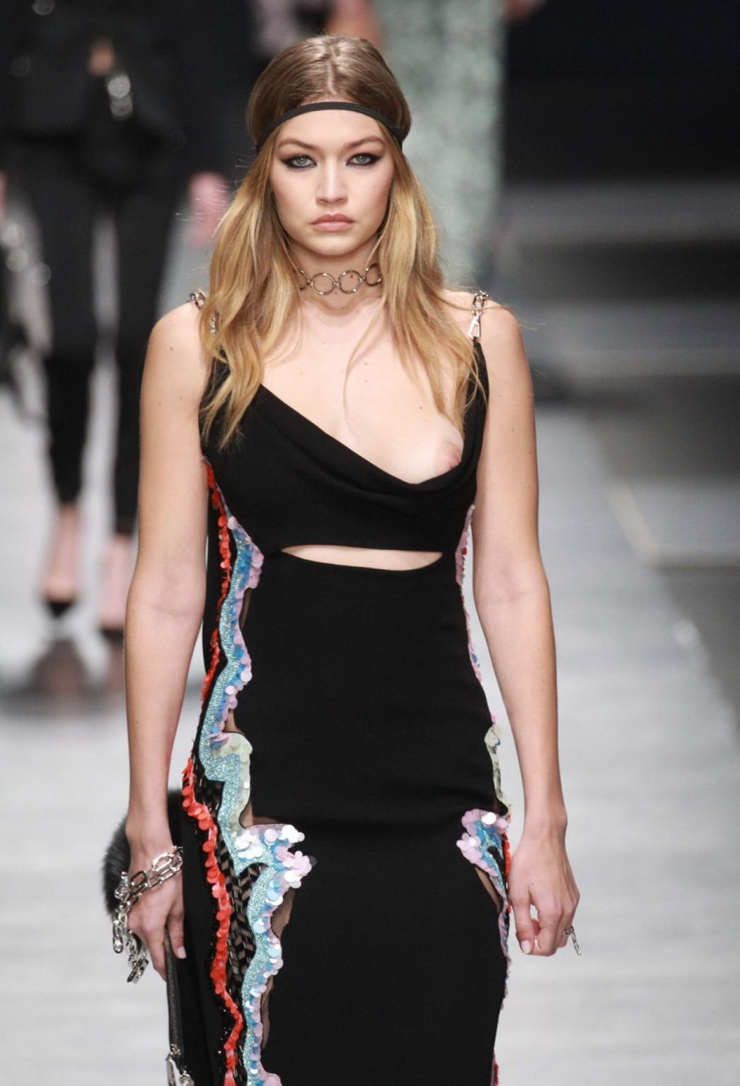 16P Gigi Hadid boob slip at the fashion show