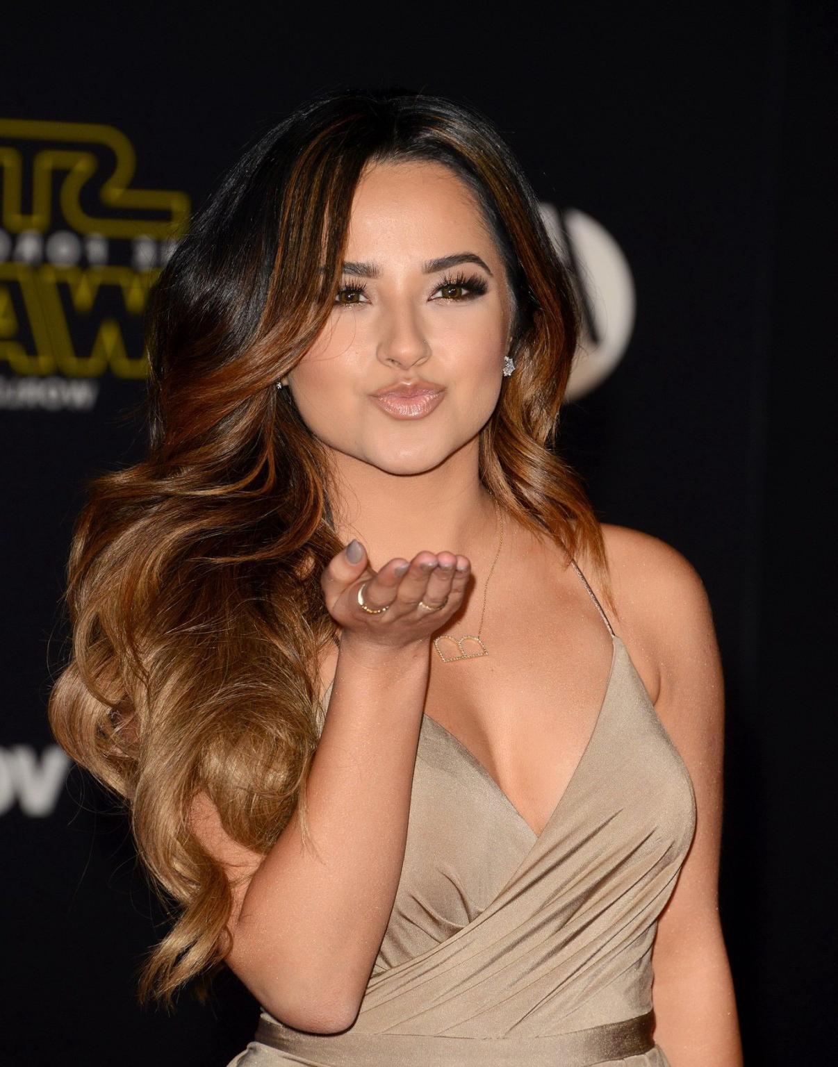 16P Busty Becky G showing huge cleavage and legs