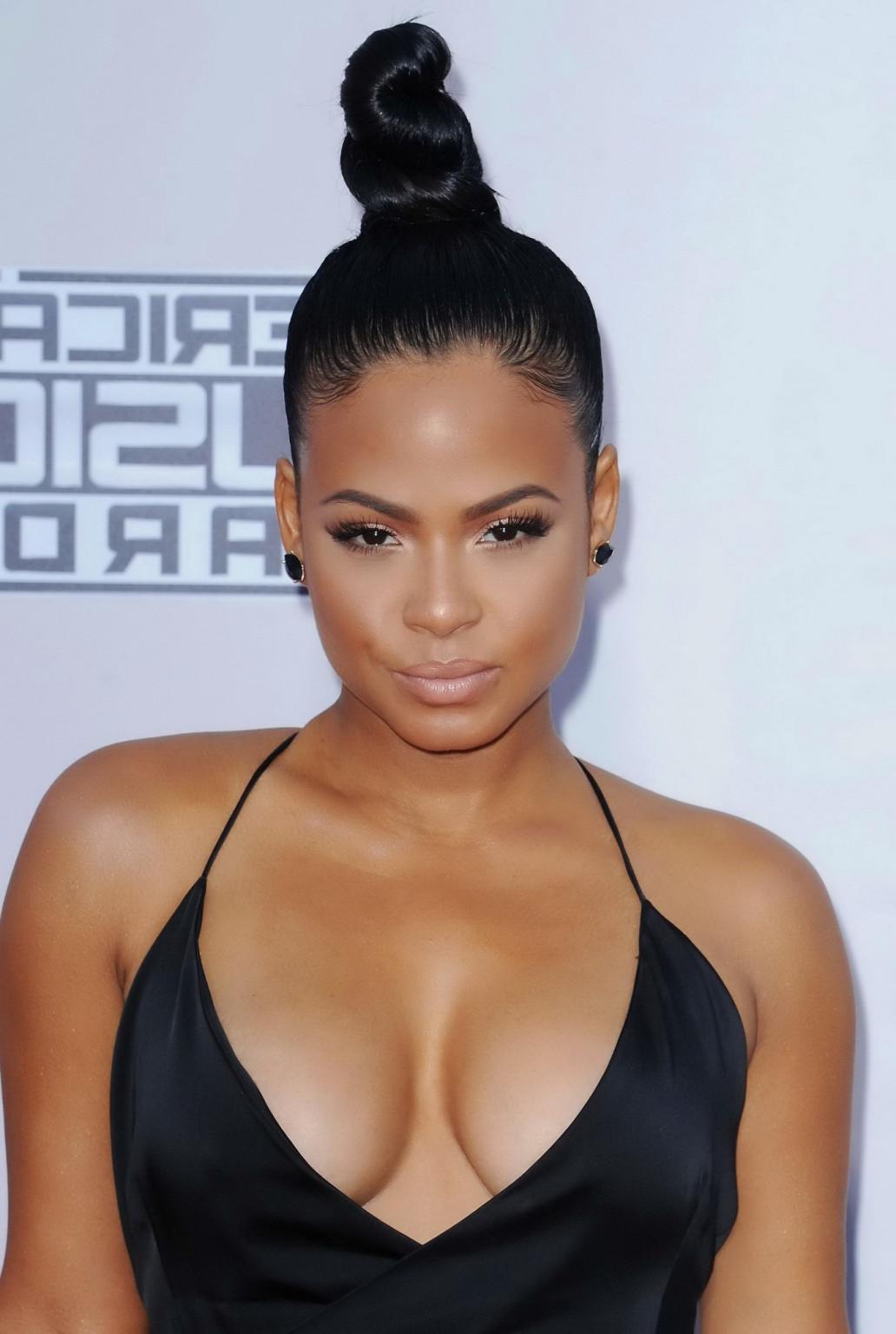 16P Christina Milian braless showing huge cleavage and legs