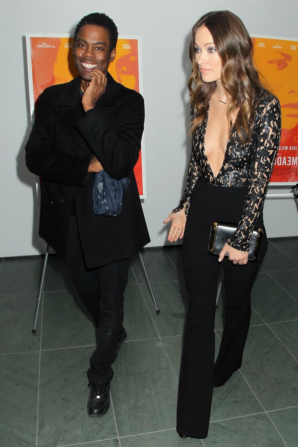 16P Olivia Wilde braless showing huge cleavage in jumpsuit
