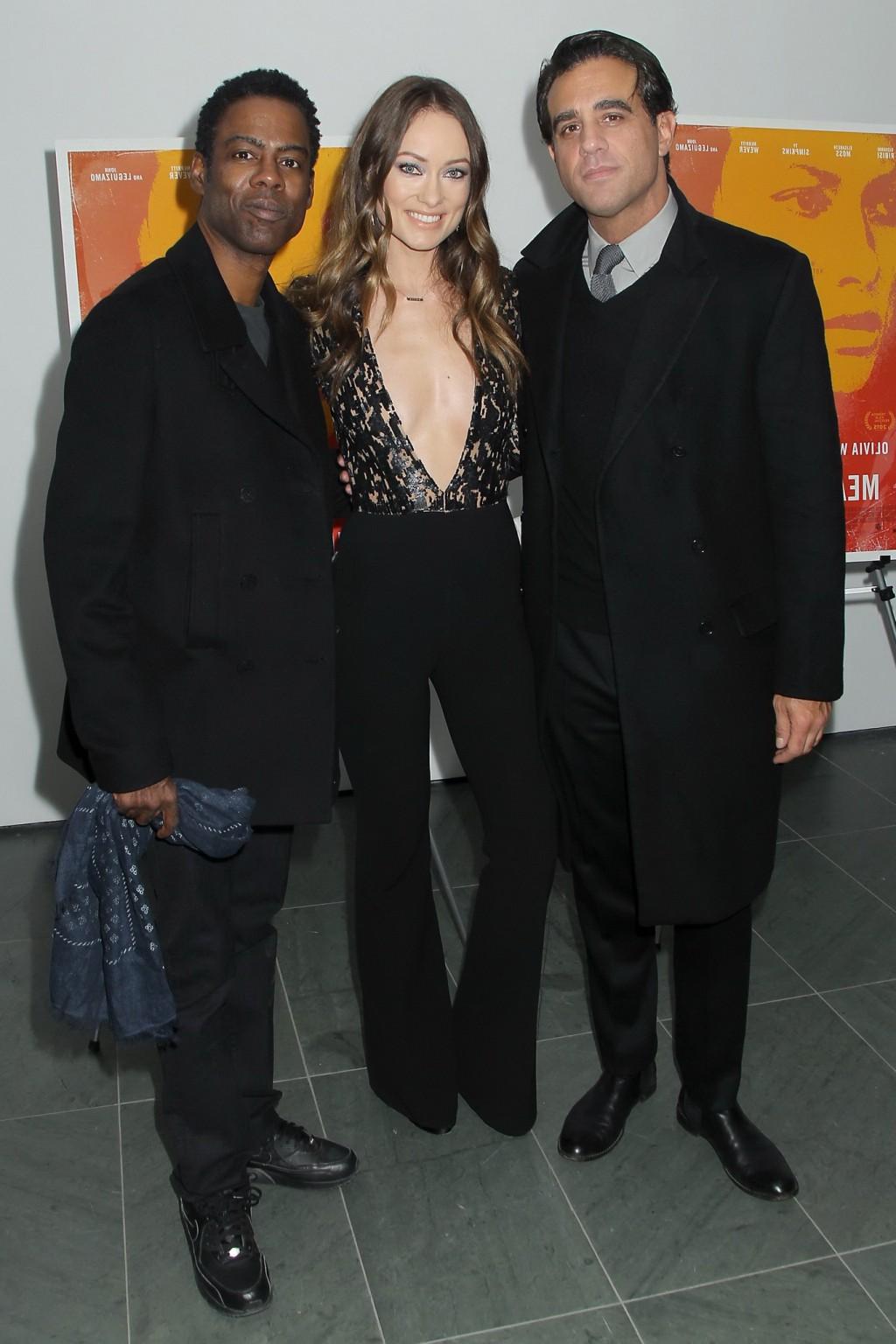 16P Olivia Wilde braless showing huge cleavage in jumpsuit