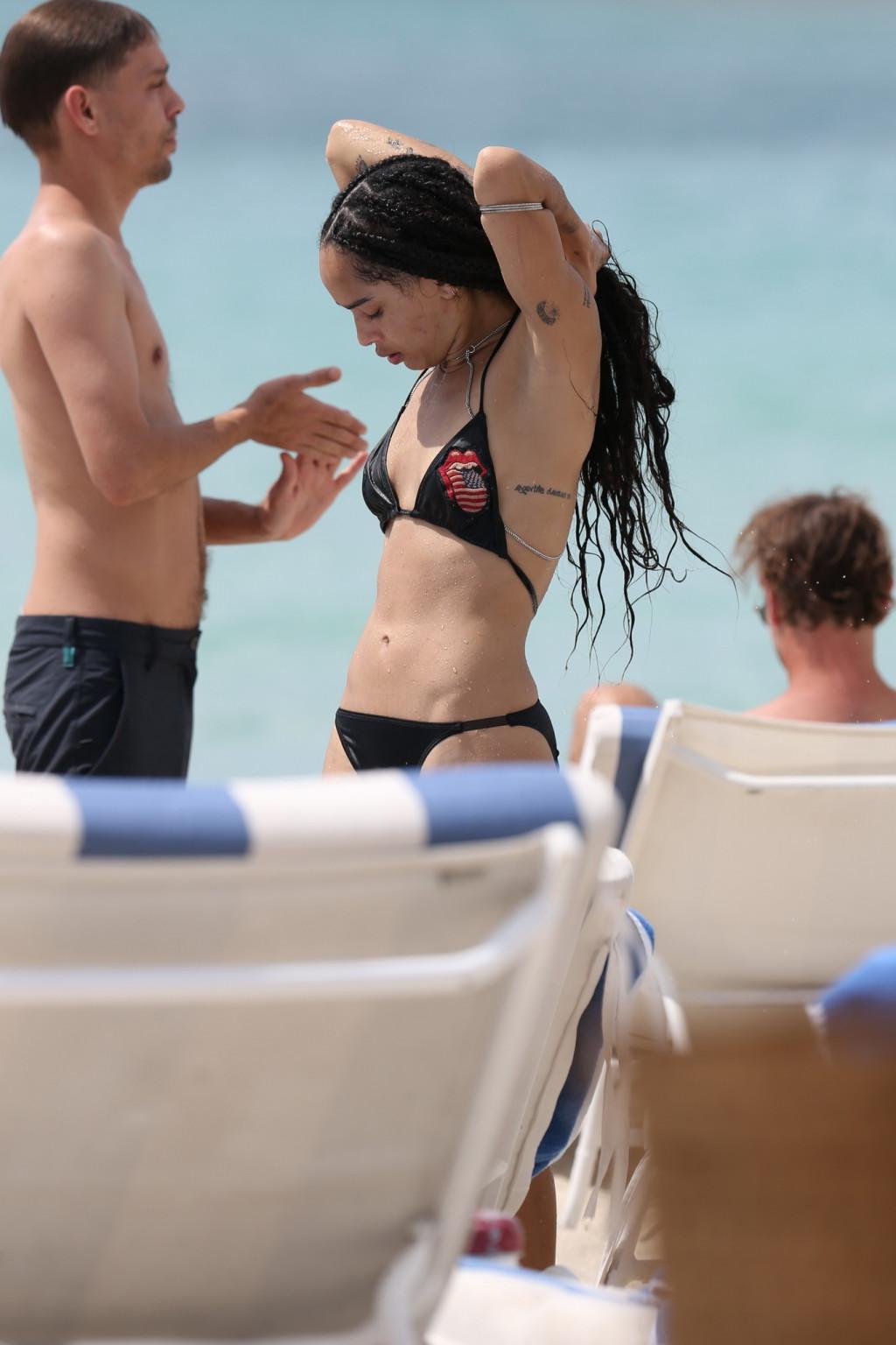 16P Zoe Kravitz showing nipple pokies in tiny black bikini