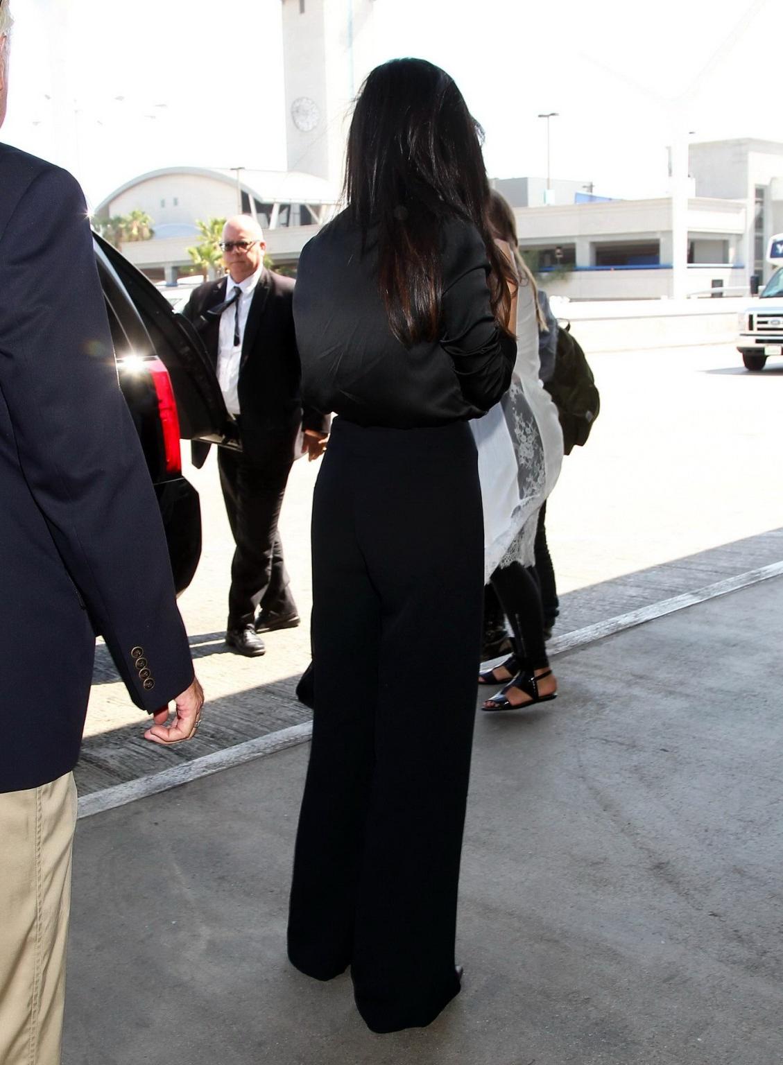 16P Selena Gomez showing huge cleavage in a wide open shirt