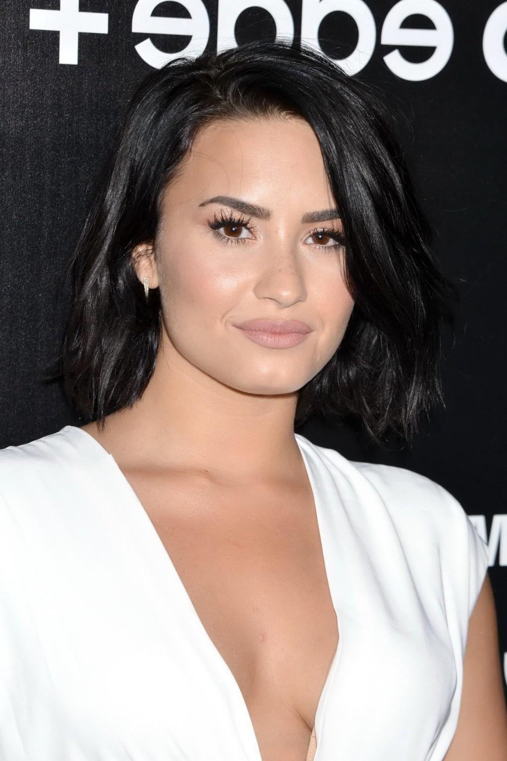 16P Demi Lovato showing huge cleavage at the party