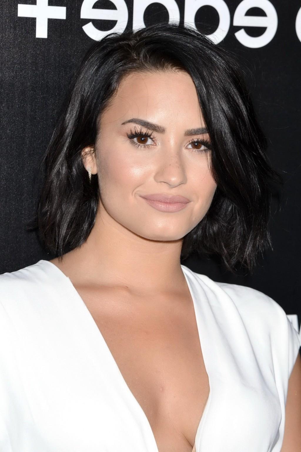 16P Demi Lovato showing huge cleavage at the party