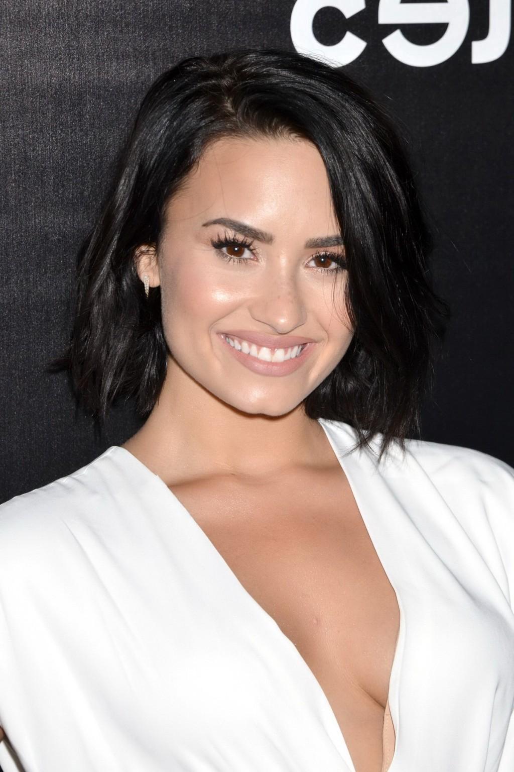16P Demi Lovato showing huge cleavage at the party