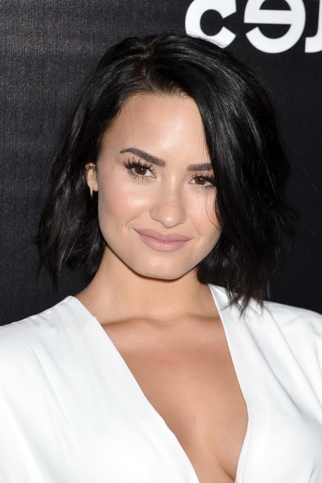 16P Demi Lovato showing huge cleavage at the party