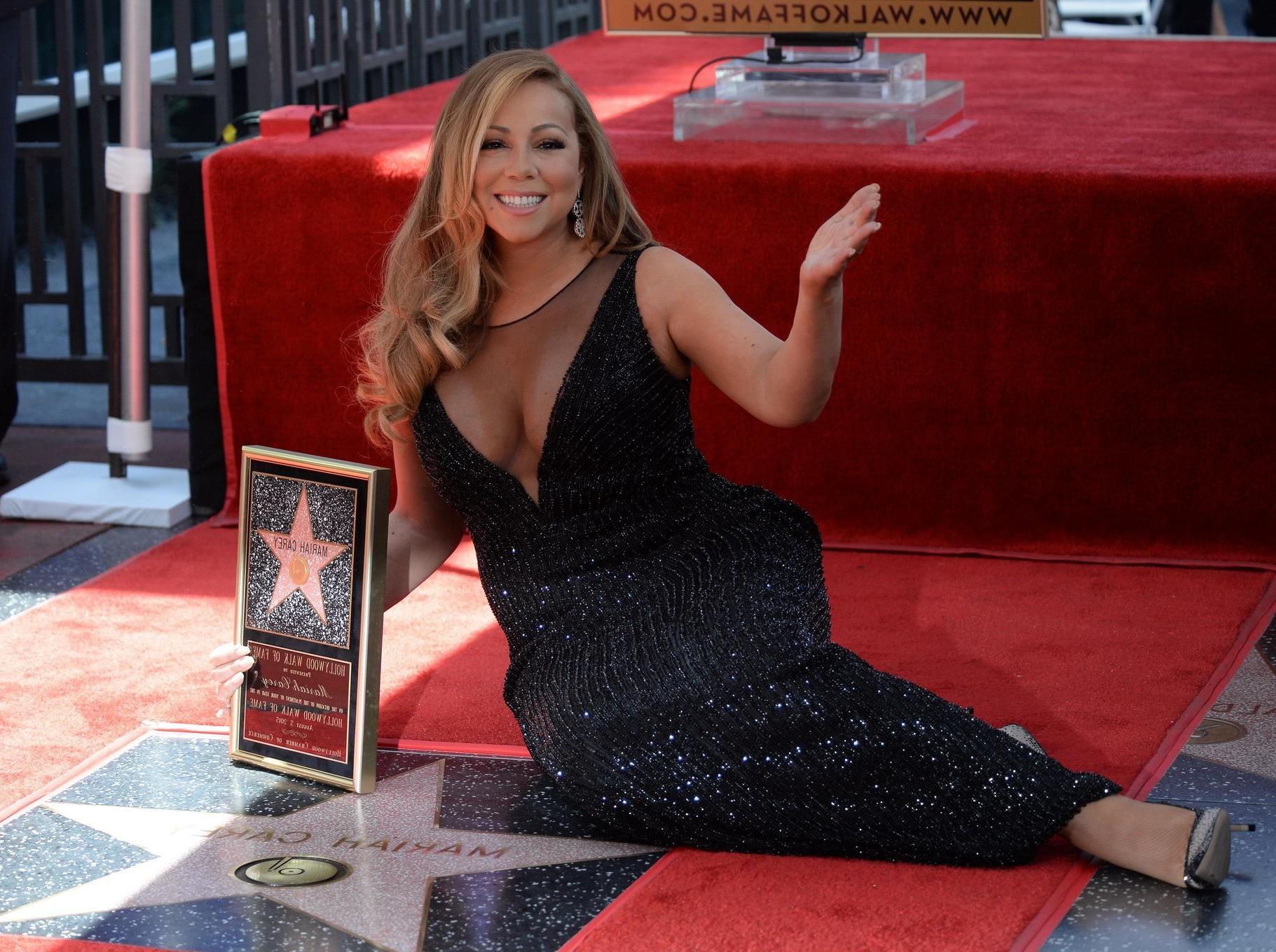 16P Mariah Carey showing huge cleavage in Hollywood