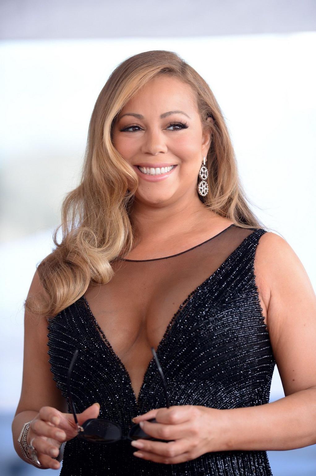 16P Mariah Carey showing huge cleavage in Hollywood
