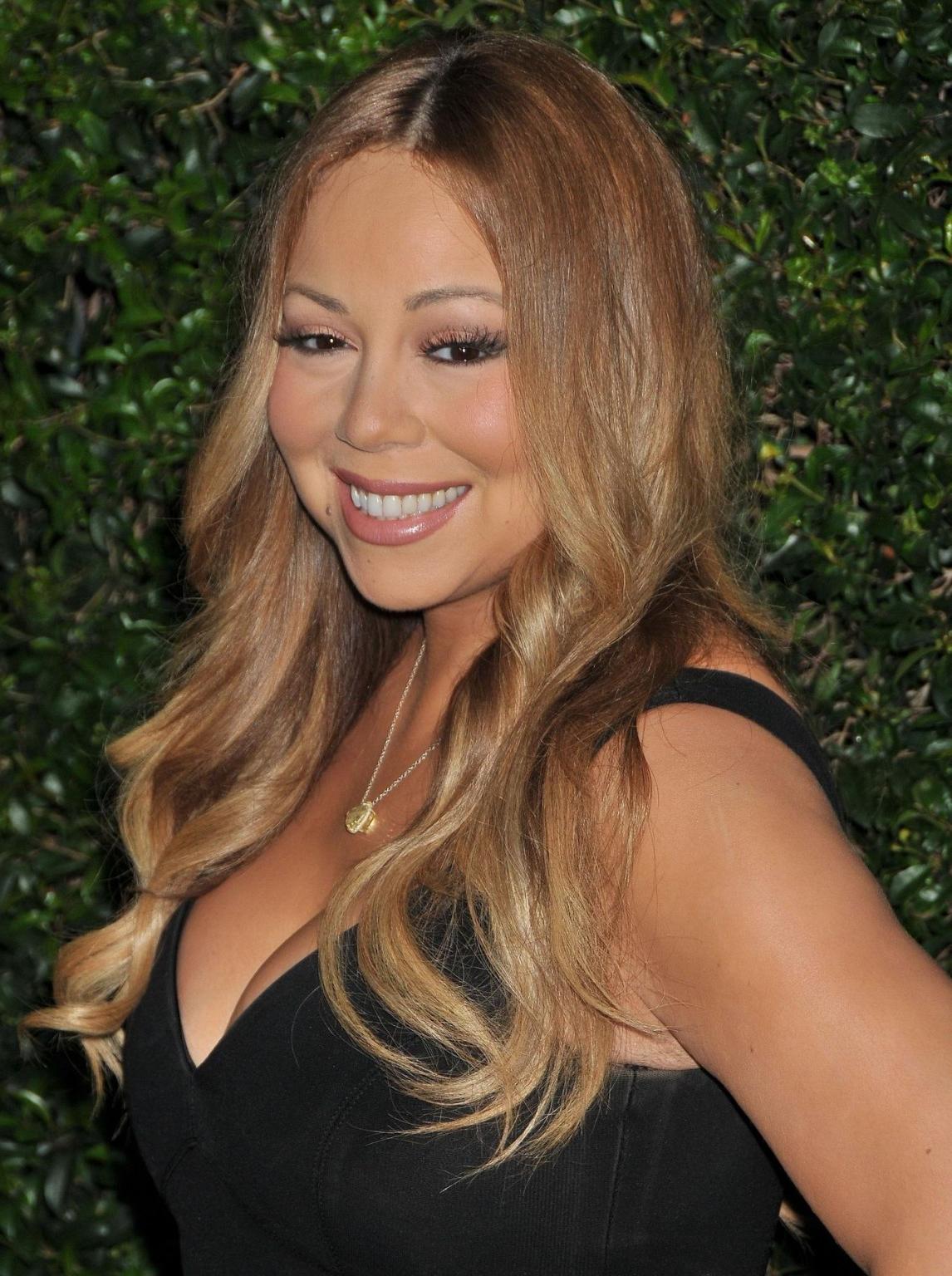 16P Mariah Carey showing huge cleavage at the Hallmark event