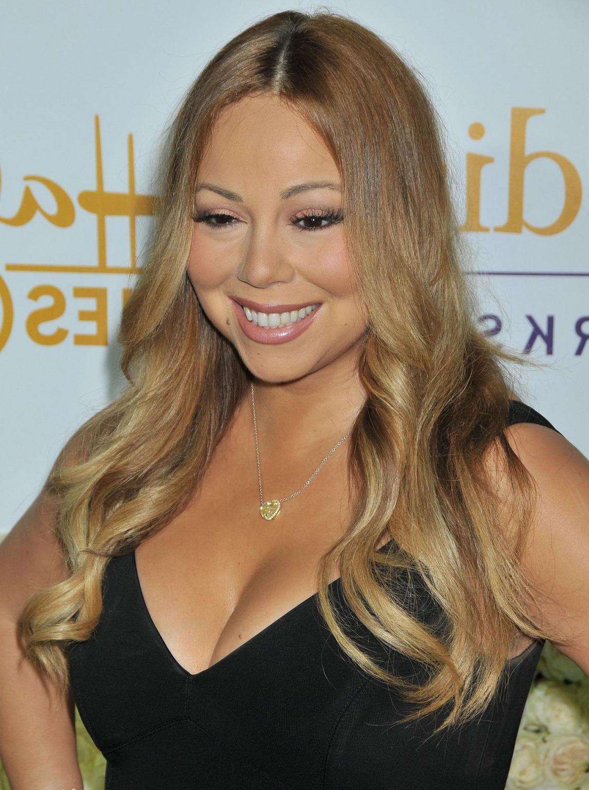 16P Mariah Carey showing huge cleavage at the Hallmark event