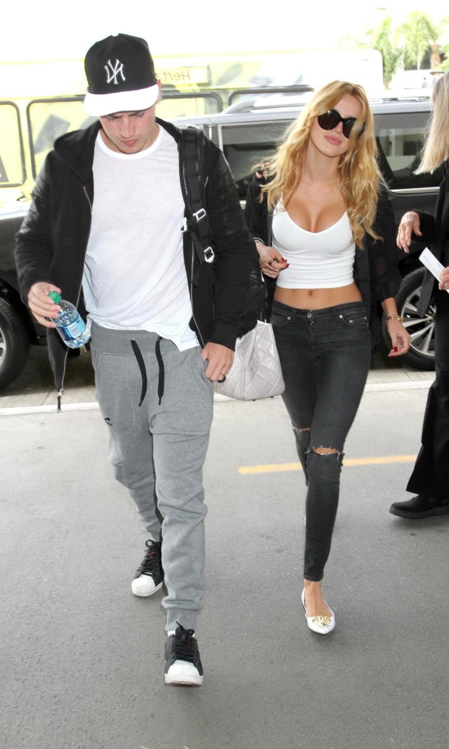 16P Bella Thorne shows huge cleavage wearing white crop top at LAX