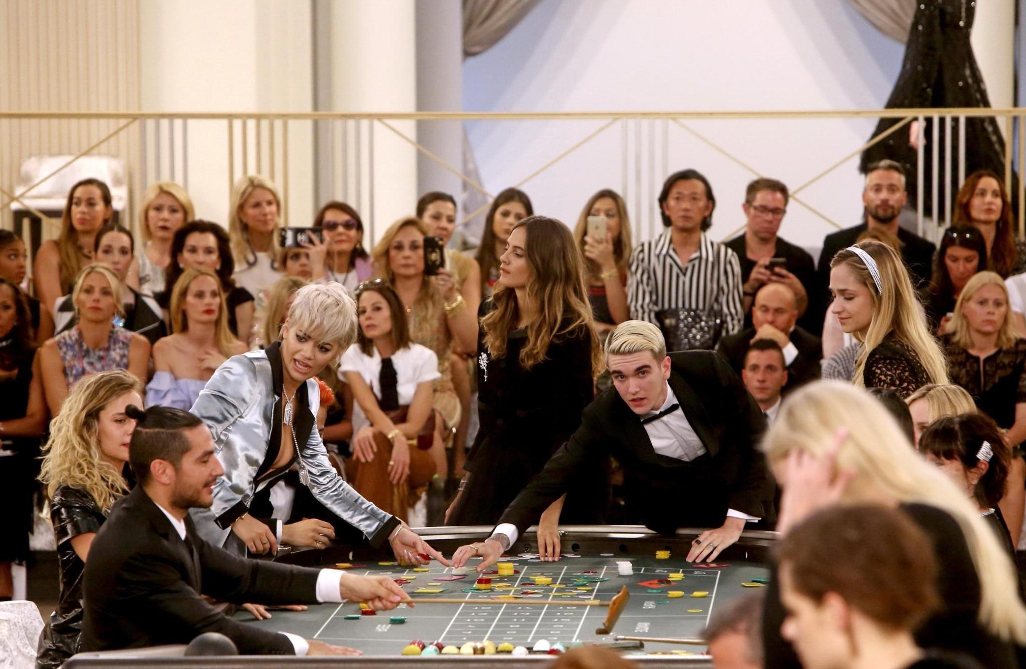 16P Rita Ora showing huge cleavage at the Chanel fashion show