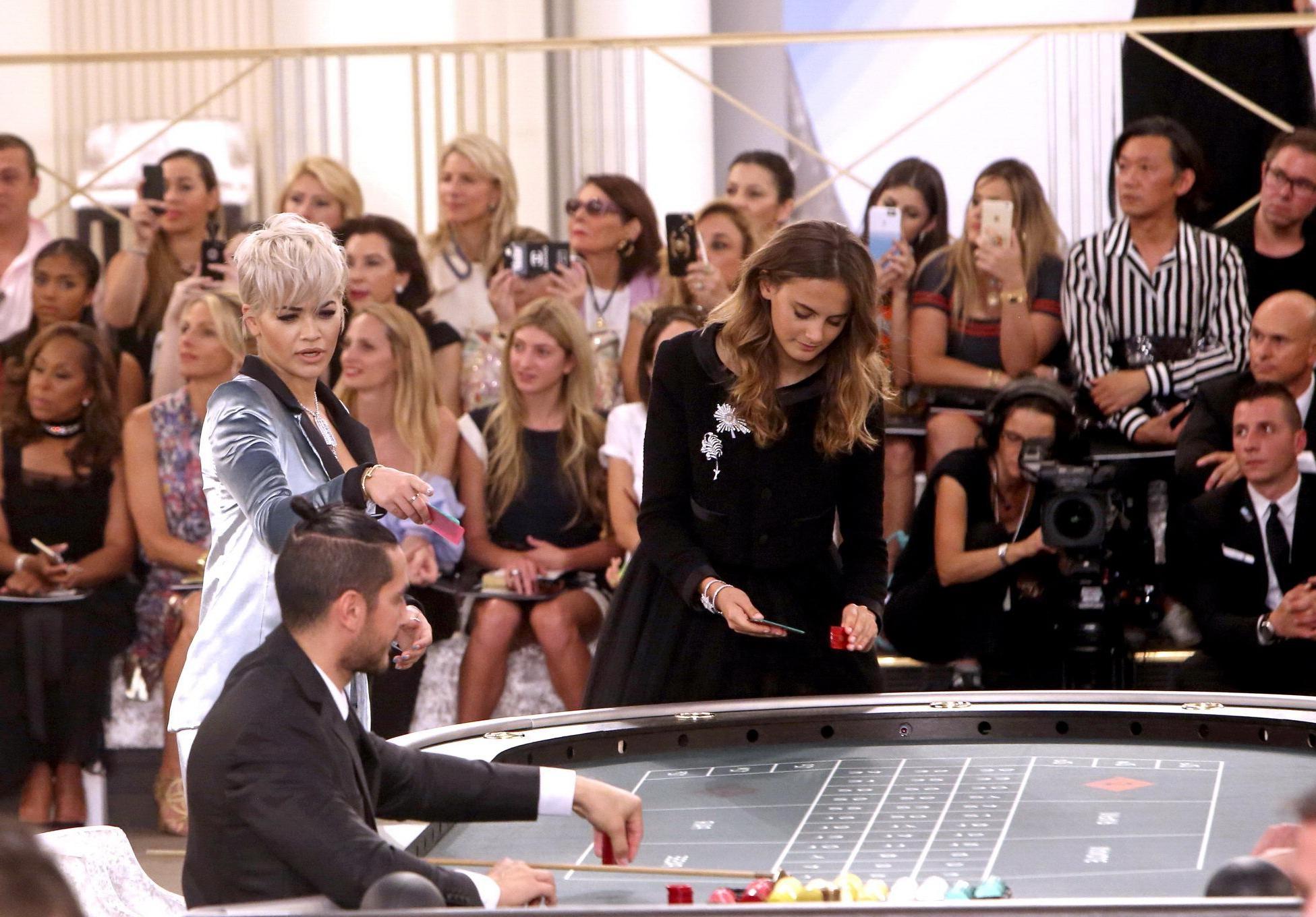 16P Rita Ora showing huge cleavage at the Chanel fashion show